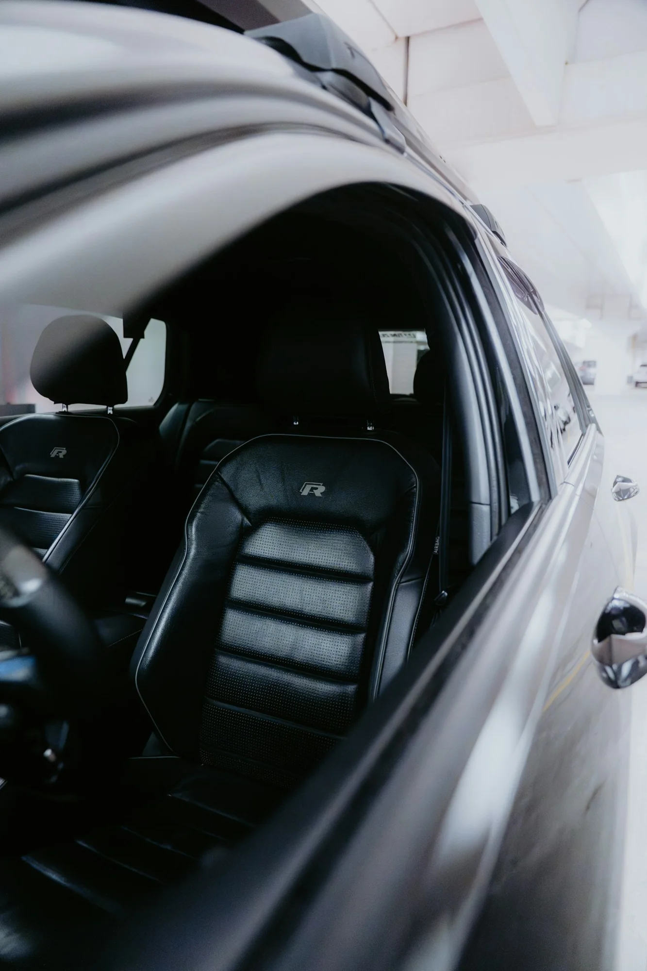 Premium black leather vehicle seating, representative interior