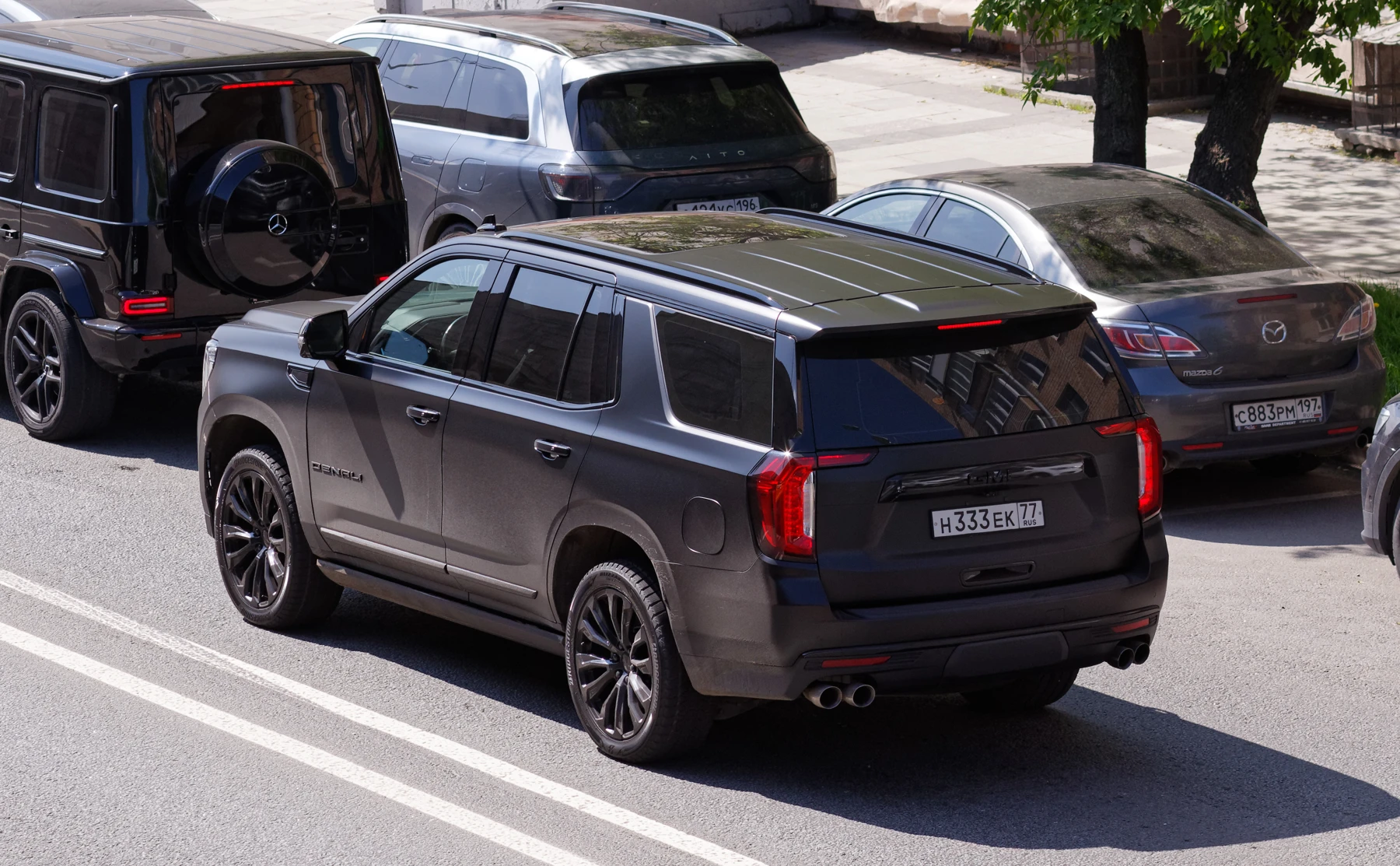 Black GMC Yukon Denali, representative fleet photography